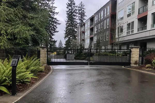 Automatic bi-parting security gate with keypad entry at a multi-family community driveway